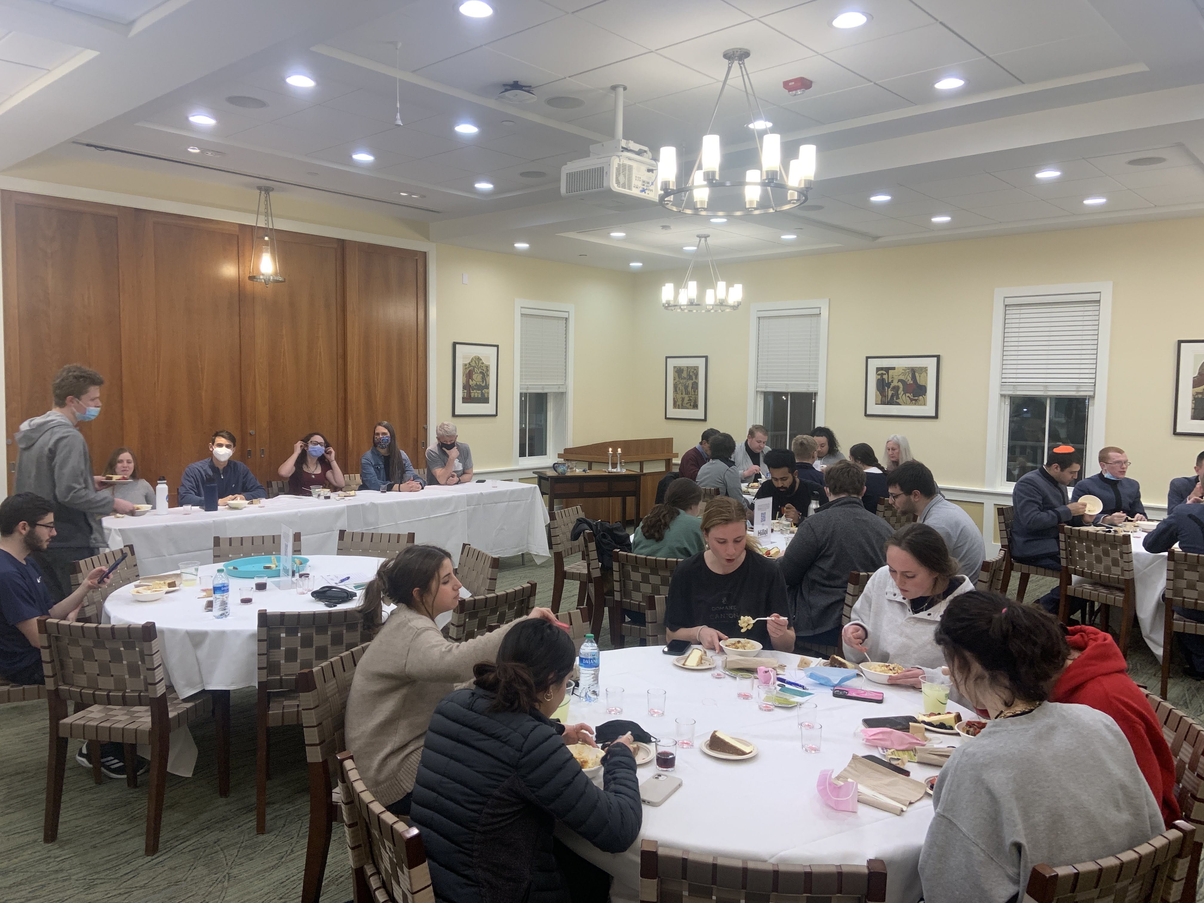 Students gather for Cheesy Love Shabbat, where a panel discusses interfaith relationships over macaroni and cheese and cheesecake.